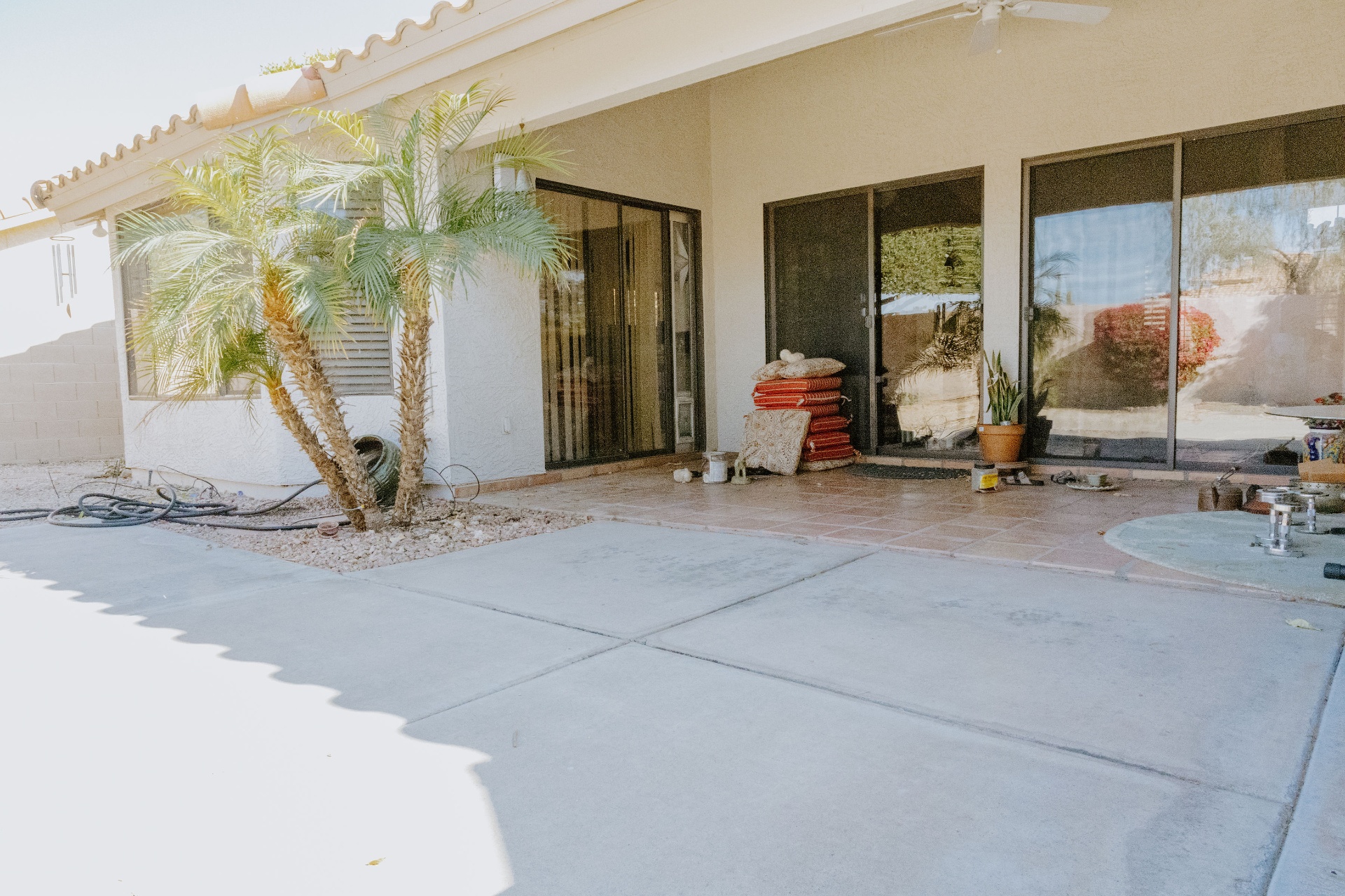 Covered Patio · Turf & Pavers before